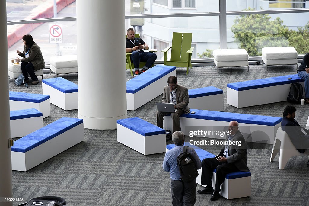 Intel Developer Forum Attendees sit on benches during the 2016 Intel Developers Forum in ...