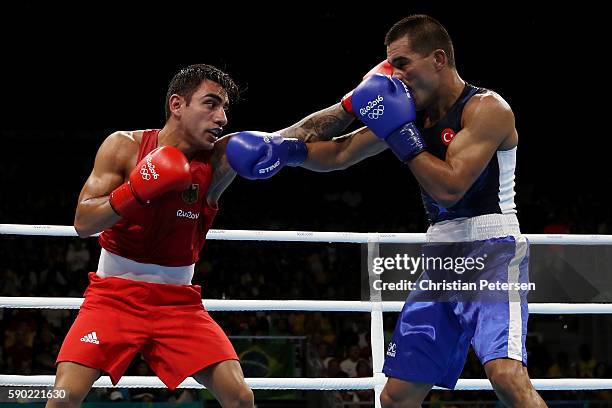 Artem Harutyunyan of Germany fights against Batuhan Gozgec of Turkey during the Men's Light Welter Quarterfinal 3 on Day 11 of the Rio 2016 Olympic...