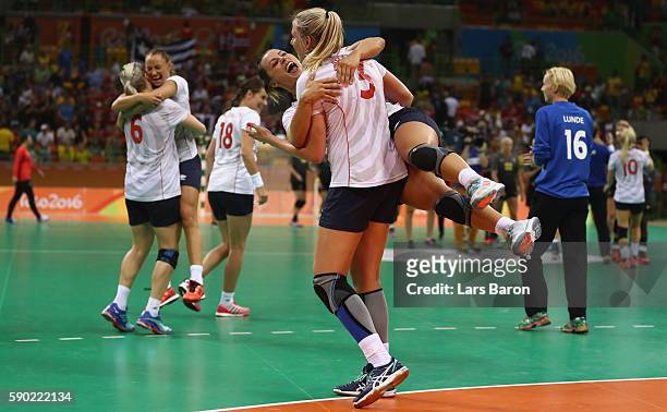 Emilie Hegh Arntzen of Norway and Nora Mork of Norway celebrate after winning the Womens Quarterfinal match between Sweden and Norway on Day 11 of...