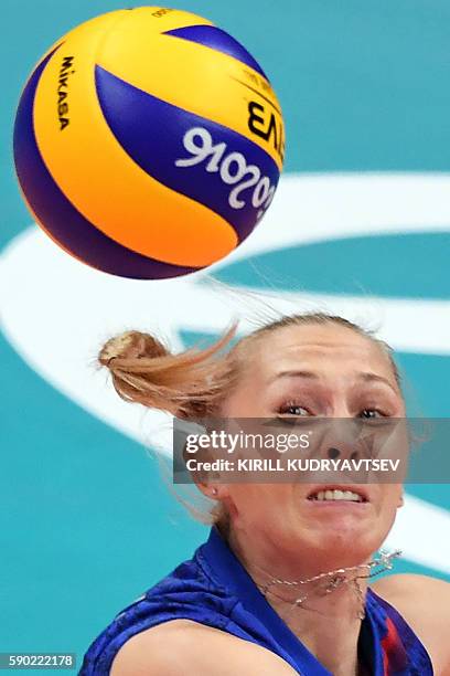 Russia's Anna Malova eyes the ball during the women's quarter-final volleyball match between Russia and Serbia at the Maracanazinho stadium in Rio de...