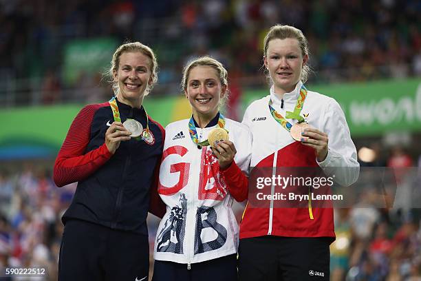 Silver medalist Sarah Hammer of the United States, gold medalist Laura Trott of Great Britain and bronze medalist Jolien D'Hoore of Belgium celebrate...