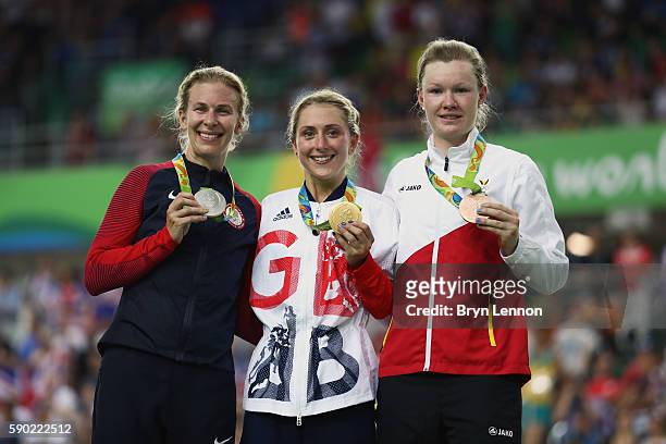 Silver medalist Sarah Hammer of the United States, gold medalist Laura Trott of Great Britain and bronze medalist Jolien D'Hoore of Belgium celebrate...