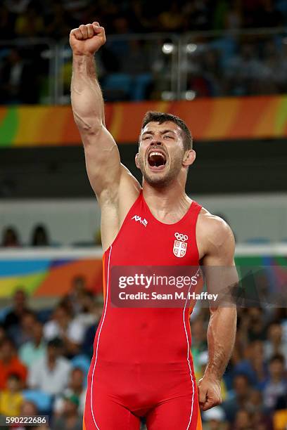 Davor Stefanek of Serbia celebrates after defeating Migran Arutyunyan of Armenia in the Men's Greco-Roman 66 kg Gold Medal bout on Day 11 of the Rio...