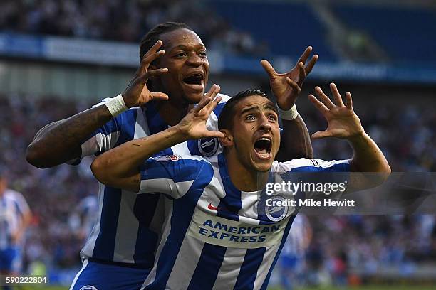 Anthony Knockaert of Brighton & Hove Albion celebrates with team mate Gaetan Bong after opening the scoring during the Sky Bet Championship match...