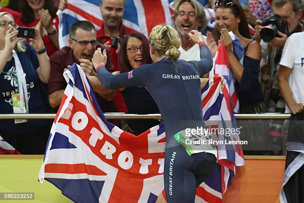Laura Trott of Great Britain celebrates with the crowd after winning gold in the women's Omnium Points race on Day 11 of the Rio 2016 Olympic Games...