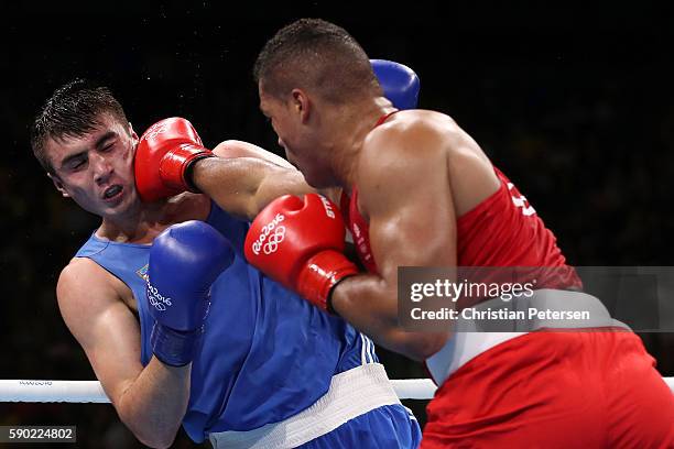 Bakhodir Jalolov of Uzbekistan fights against Joe Joyce of Great Britain during the Men's Super Heavy Quarterfinal 3 on Day 11 of the Rio 2016...