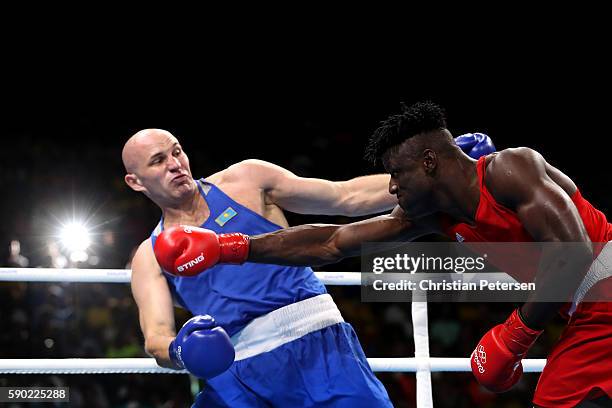 Efe Ajagba of Nigeria fights against Ivan Dychko of Kazakhstan during the Men's Super Heavy Quarterfinal 4 on Day 11 of the Rio 2016 Olympic Games at...