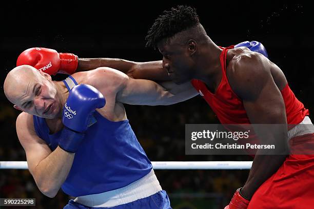 Efe Ajagba of Nigeria fights against Ivan Dychko of Kazakhstan during the Men's Super Heavy Quarterfinal 4 on Day 11 of the Rio 2016 Olympic Games at...