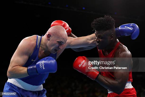 Efe Ajagba of Nigeria fights against Ivan Dychko of Kazakhstan during the Men's Super Heavy Quarterfinal 4 on Day 11 of the Rio 2016 Olympic Games at...