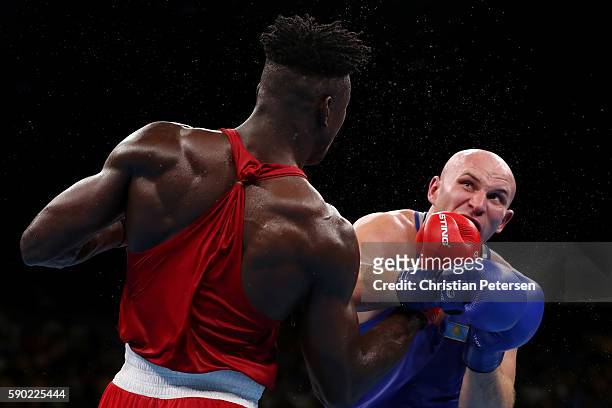 Ivan Dychko of Kazakhstan fights against Efe Ajagba of Nigeria during the Men's Super Heavy Quarterfinal 4 on Day 11 of the Rio 2016 Olympic Games at...