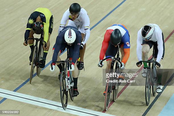 Gold medalist Jason Kenny of Great Britain, silver medalist Matthijs Buchli of the Netherlands and bronze medalist Azizulhasni Awang of Malaysia...
