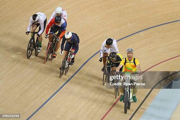 Jason Kenny of Great Britain, Matthijs Buchli of the Netherlands and Azizulhasni Awang of Malaysia compete during the Men's Keirin Finals race on Day...