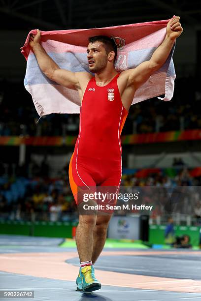 Davor Stefanek of Serbia celebrates after defeating Migran Arutyunyan of Armenia in the Men's Greco-Roman 66 kg Gold Medal bout on Day 11 of the Rio...