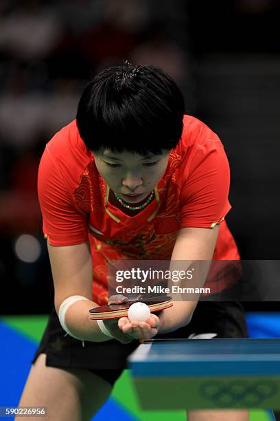 Xiaoxia Li of China plays a match against Ying Han of Germany in the Women's Team Gold Medal Team Match between China and Germany on Day 11 of the...