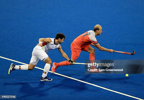 Billy Bakker of the Netherlands is defended by Loick Luypaert of Belgium during a semifinal match on Day 11 of the Rio 2016 Olympic Games at the...