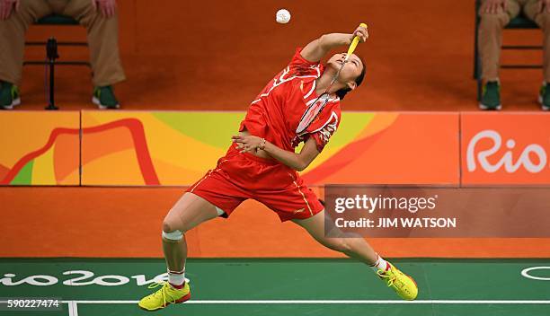 China's Wang Yihan returns against India's Pusarla V. Sindhu during their women's singles quarter-final badminton match at the Riocentro stadium in...