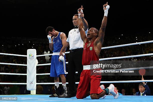 Robson Conceicao of Brazil celebrates after winning gold against Sofiane Oumiha of France in the Men's Light event on Day 11 of the Rio 2016 Olympic...