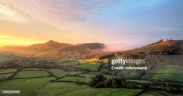 foggy sunrise over tipperary mountains - ireland aerial stock pictures, royalty-free photos & images