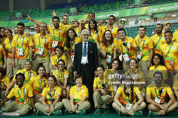 Union Cycliste Internationale President Brian Cookson takes a photo with Rio 2016 workers on Day 11 of the Rio 2016 Olympic Games at the Rio Olympic...