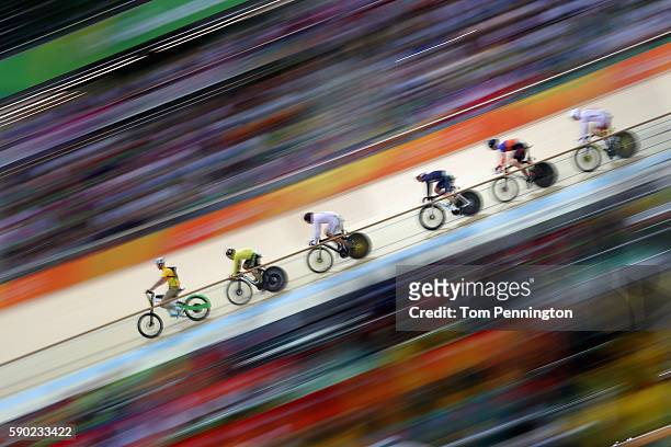 Jason Kenny of Great Britain, Matthijs Buchli of the Netherlands, Azizulhasni Awang of Malaysia compete during the Men's Keirin Finals race on Day 11...