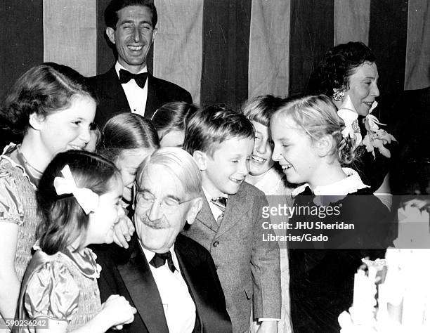 American philosopher, psychologist, and educational reformer John Dewey is surrounded by his children, celebrating his 90th birthday, 1949. .