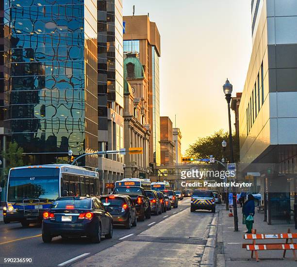 scene of downtown street with traffic in evening - regina saskatchewan stock pictures, royalty-free photos & images