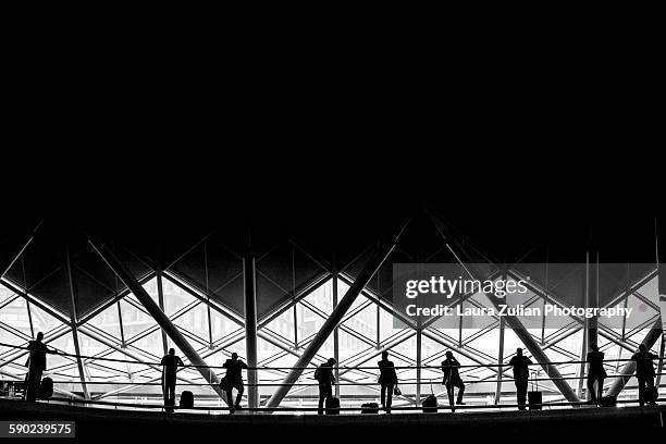 waiting at kings cross station - laura zulian stockfoto's en -beelden