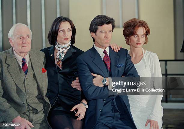 Irish actor Pierce Brosnan poses with his co-stars Desmond Llewelyn , Famke Janssen and Izabella Scorupco during a publicity shoot for the James Bond...