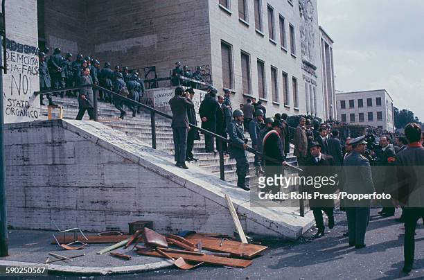 View of police and members of the Italian military standing on the steps outside a wrecked lecture hall of the Sapienza University of Rome campus...
