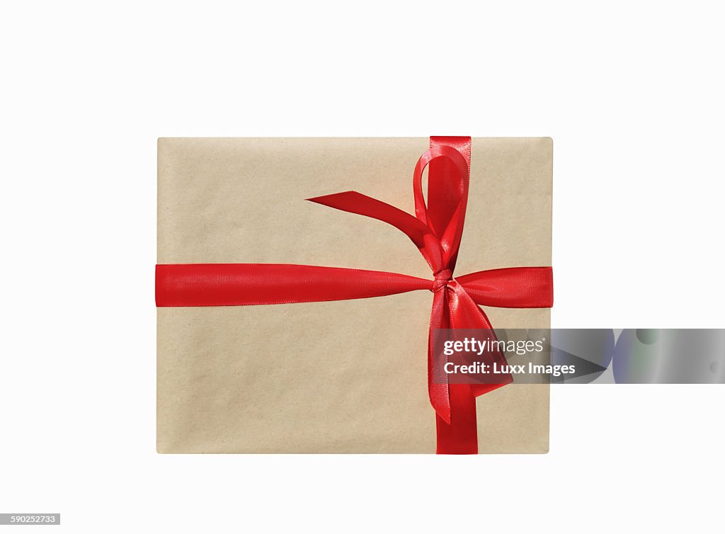 Single present with red ribbon