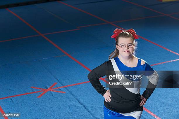 teenage girl with down syndrome cheerleading - down syndrome girl stock pictures, royalty-free photos & images