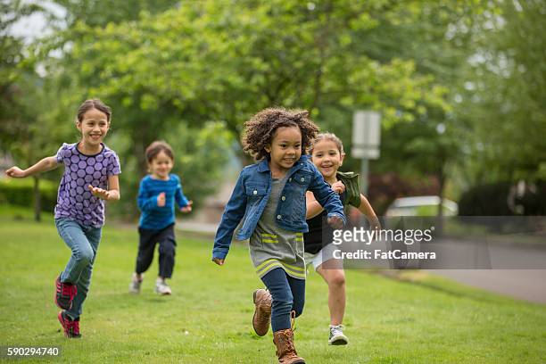 young diverse girls playing together - community safety stock pictures, royalty-free photos & images