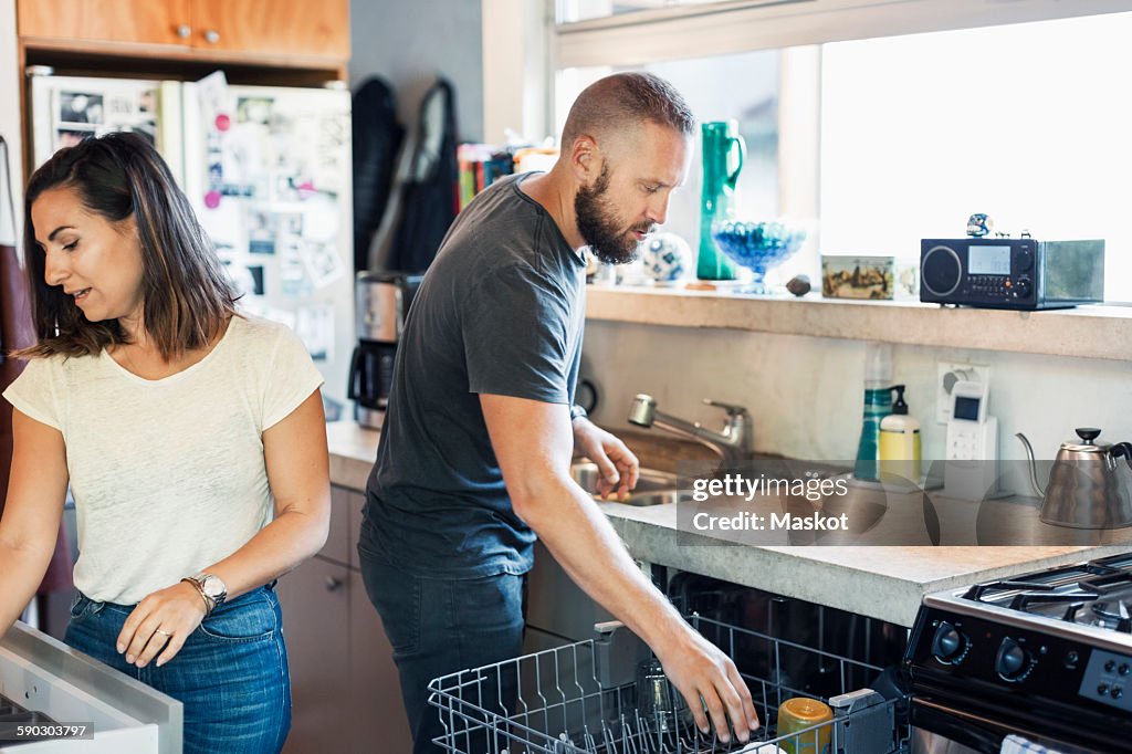 Couple working together in kitchen