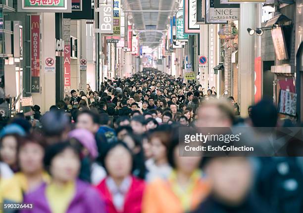 crowd shopping at minami area in osaka, japan - population growth stock pictures, royalty-free photos & images