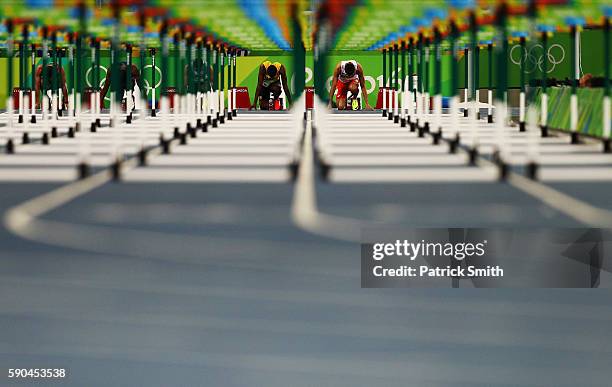 Deuce Carter of Jamaica and Damian Czykier of Poland wait for the start of the Men's 110m Hurdles Semifinals on Day 11 of the Rio 2016 Olympic Games...