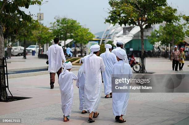 muslim kids walking away - sunni islam stock pictures, royalty-free photos & images