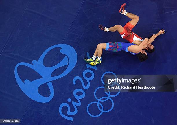 Rasul Chunayev of Azerbaijan competes against Hansu Ryu of Korea in the Men's Greco-Roman 66 kg Bronze final bout on Day 11 of the Rio 2016 Olympic...