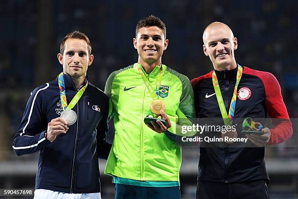 Silver medalist Renaud Lavillenie of France, gold medalist Thiago Braz da Silva of Brazil and bronze medalist Sam Kendricks of the United States pose...