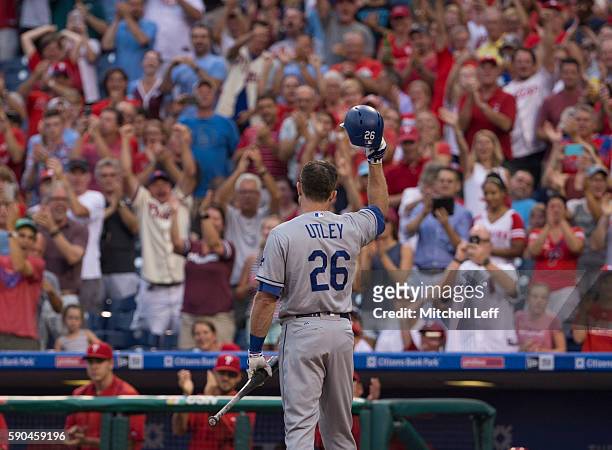 Chase Utley of the Los Angeles Dodgers tips his hat to the crowd prior to his at bat in the first inning against the Philadelphia Phillies at...