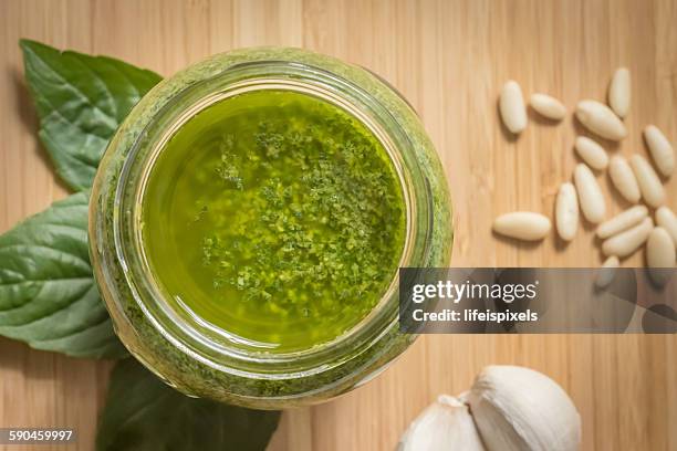 jar of homemade basil pesto - lifeispixels stock pictures, royalty-free photos & images