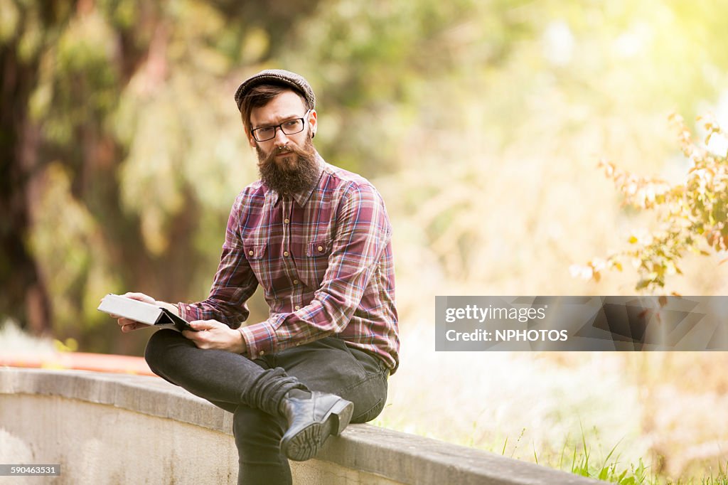 Hipster man using his digital tablet