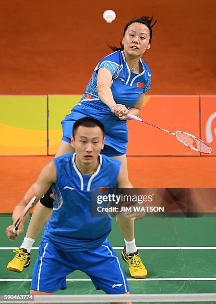 China's Zhang Nan and China's Zhao Yunlei return against China's Xu Chen and China's Ma Jin during their mixed doubles Bronze Medal badminton match...