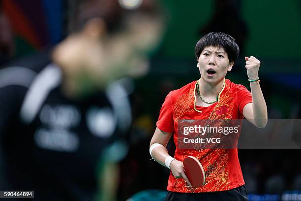 Li Xiaoxia of China competes against Han Ying of Germany in the Women's Team Gold Medal Team Match between China and Germany on Day 11 of the Rio...