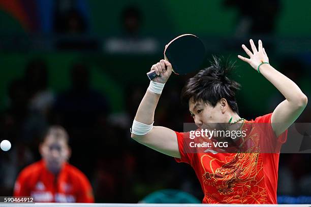 Li Xiaoxia of China competes against Han Ying of Germany in the Women's Team Gold Medal Team Match between China and Germany on Day 11 of the Rio...