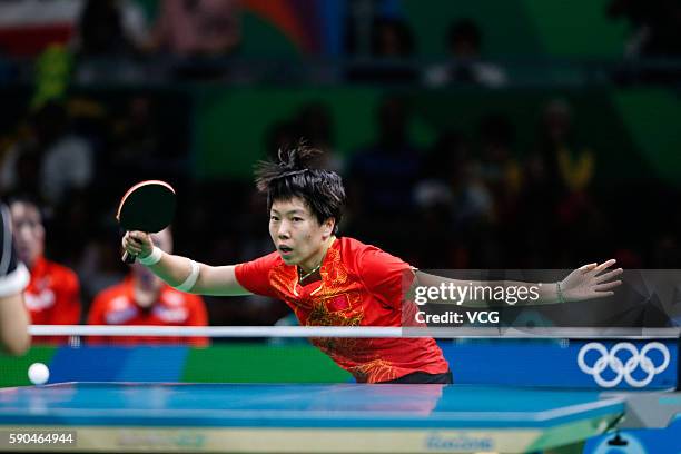 Li Xiaoxia of China competes against Han Ying of Germany in the Women's Team Gold Medal Team Match between China and Germany on Day 11 of the Rio...