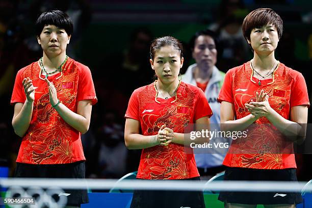 Li Xiaoxia, Liu Shiwen and Ding Ning of China line up for the Women's Team Gold Medal Team Match between China and Germany on Day 11 of the Rio 2016...