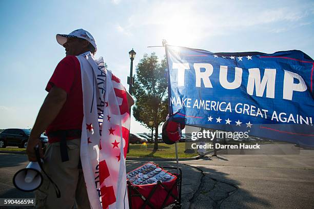 Vendor sells Trump memorabilia before Republican presidential nominee Donald Trump speaks at a rally on August 16, 2016 in West Bend, Wisconsin.