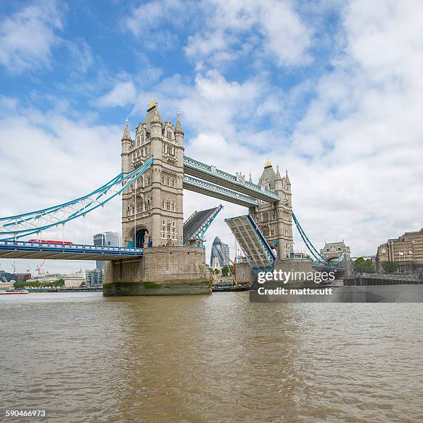 tower bridge with bascules raised, london, england, uk - mattscutt imagens e fotografias de stock