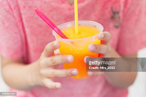 close-up of a boy drinking orange juice - smoothie close up textfreiraum stock-fotos und bilder