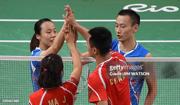 China's Zhang Nan and China's Zhao Yunlei react after winning against China's Xu Chen and China's Ma Jin during their mixed doubles Bronze Medal...